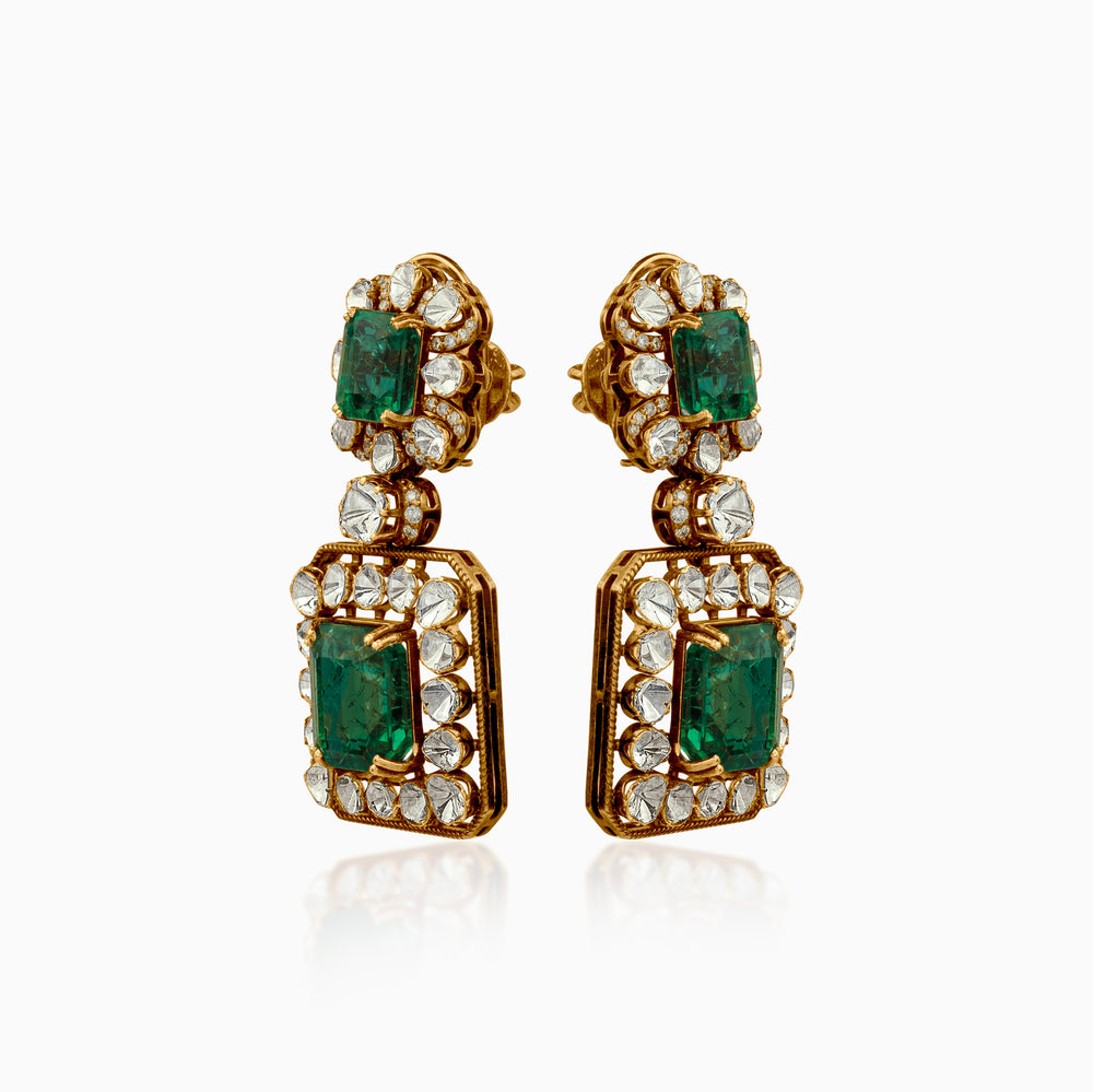 Emerald and diamond statement earrings in ornate gold setting