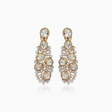 Ornate gold chandelier earrings with diamond-like stones in cascading circular design